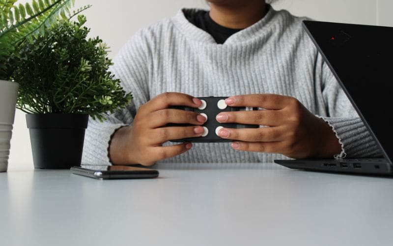 small black handheld keyboard with 8 input keys